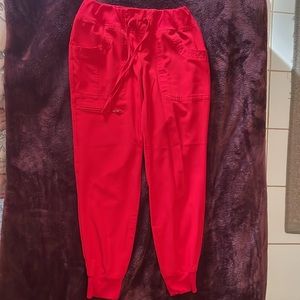 Two red heart soul scrub joggers.